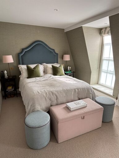 Slate blue headboard in Romo Forenza Monsoon and footstools in Colefax and Fowler Flynn for PH Interiors